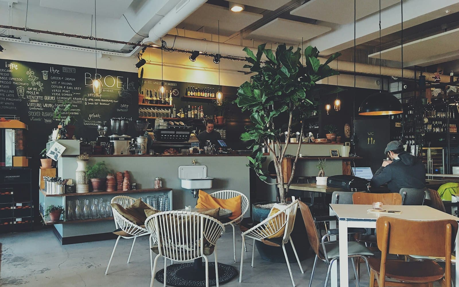 A neighbourhood café with a printed menu on the counter
